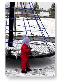 Child Playing on Snow Covered Apollo