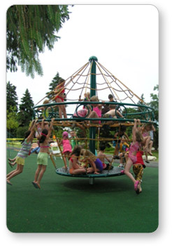 Children spinning on an Astro Rotating Climber