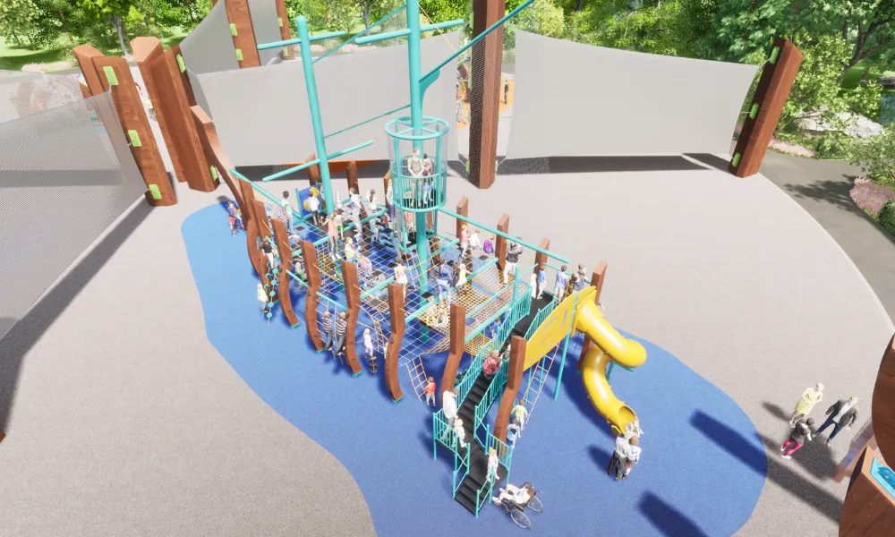 A large play structure with climbing nets, a yellow slide, and a tall crows nest lookout, filled with children at play.