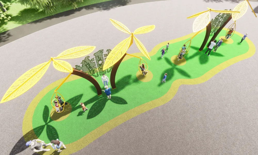 Overhead view of a playground with leaf-shaped canopy structures shading rotating pods on a green and yellow play surface.