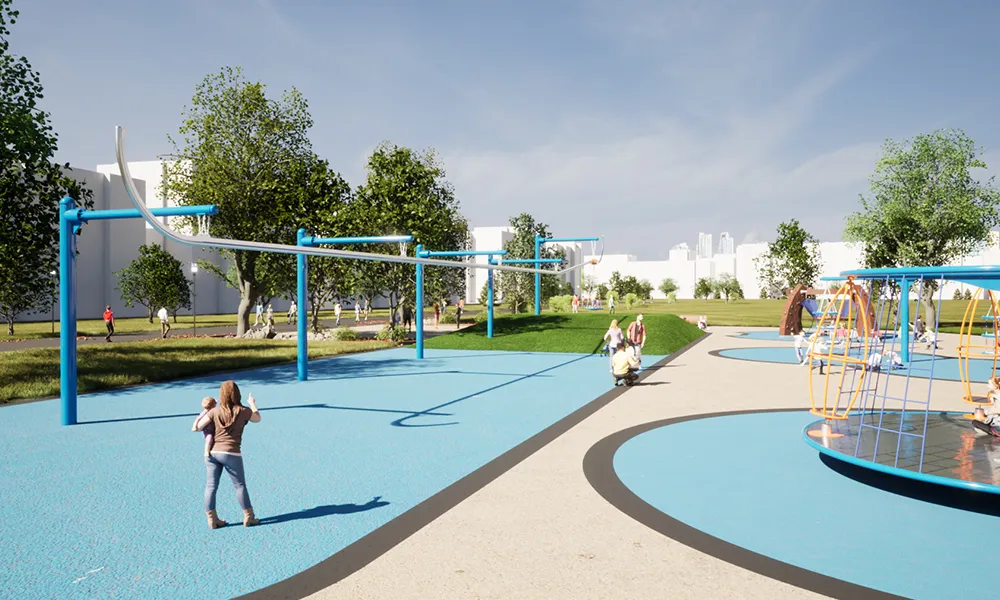 A park scene featuring an extended track ride system above blue surfacing, with families and play structures nearby.