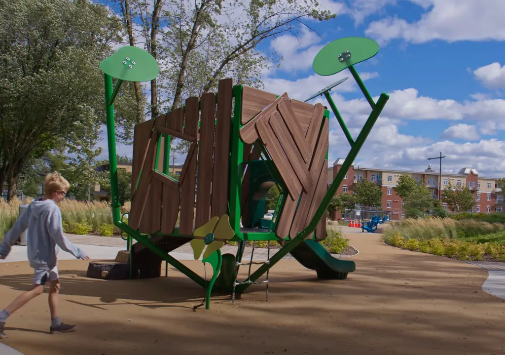 Nature-themed playground structure with slide and climbing features
